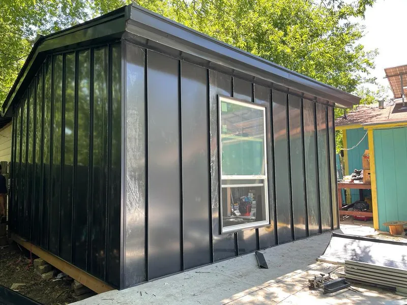 Black standing seam metal wall panels for Roof Inspection in Woodstock